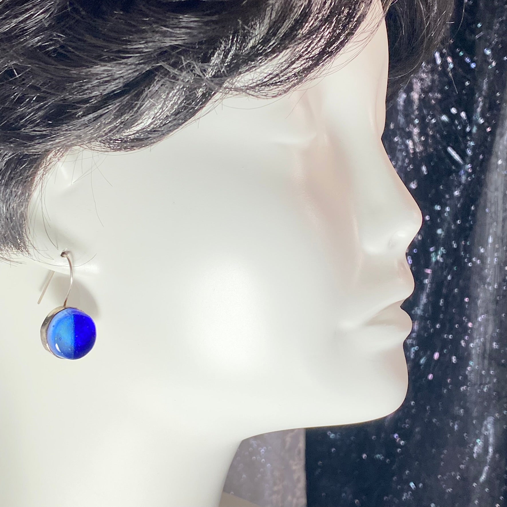 two tone circle earrings in light and dark blue,fused glass, glass jewelry, glass and silver jewelry, handmade, handcrafted, American Craft, hand fabricated jewelry, hand fabricated jewellery, Athen, Georgia, colorful jewelry, sparkle, bullseye glass, dichroic glass, art jewelry