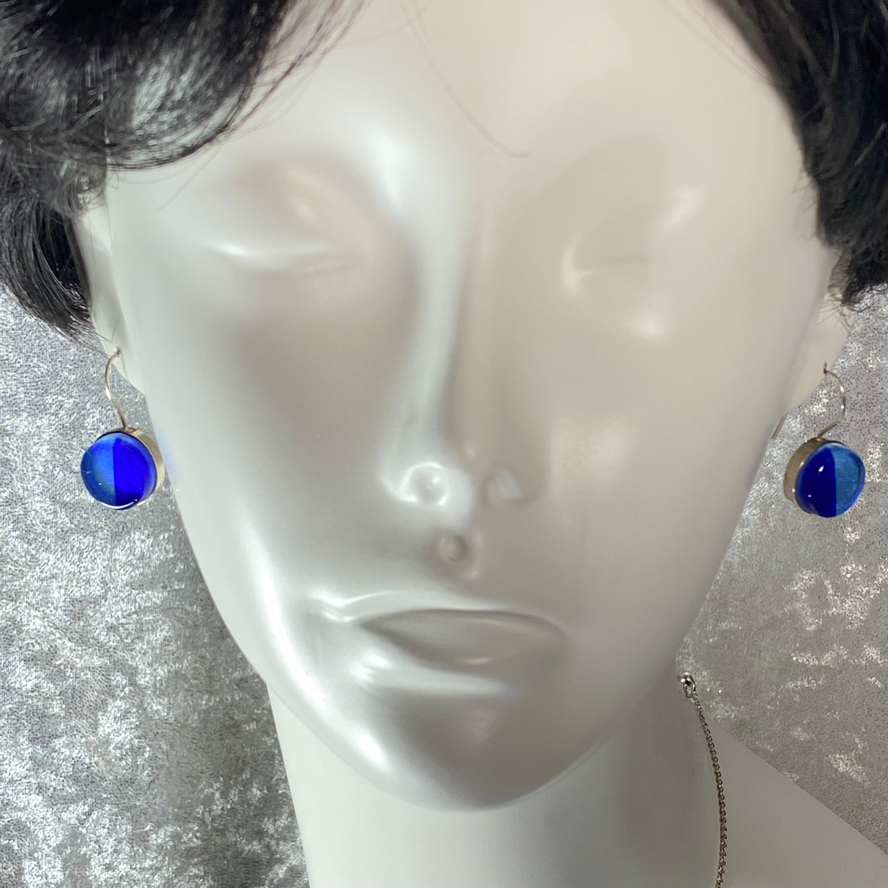 two tone circle earrings in light and dark blue,fused glass, glass jewelry, glass and silver jewelry, handmade, handcrafted, American Craft, hand fabricated jewelry, hand fabricated jewellery, Athen, Georgia, colorful jewelry, sparkle, bullseye glass, dichroic glass, art jewelry