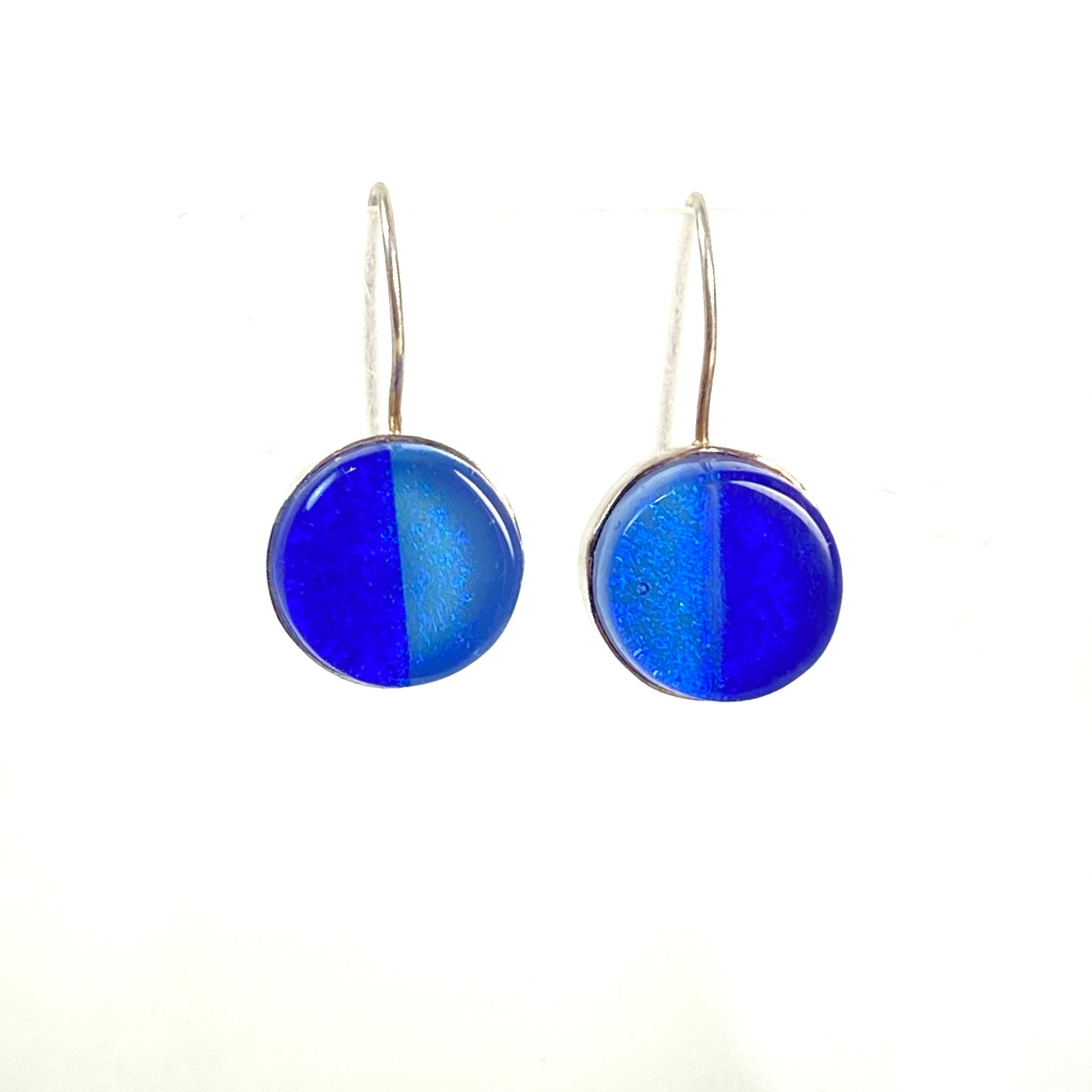 two tone circle earrings in light and dark blue,fused glass, glass jewelry, glass and silver jewelry, handmade, handcrafted, American Craft, hand fabricated jewelry, hand fabricated jewellery, Athen, Georgia, colorful jewelry, sparkle, bullseye glass, dichroic glass, art jewelry