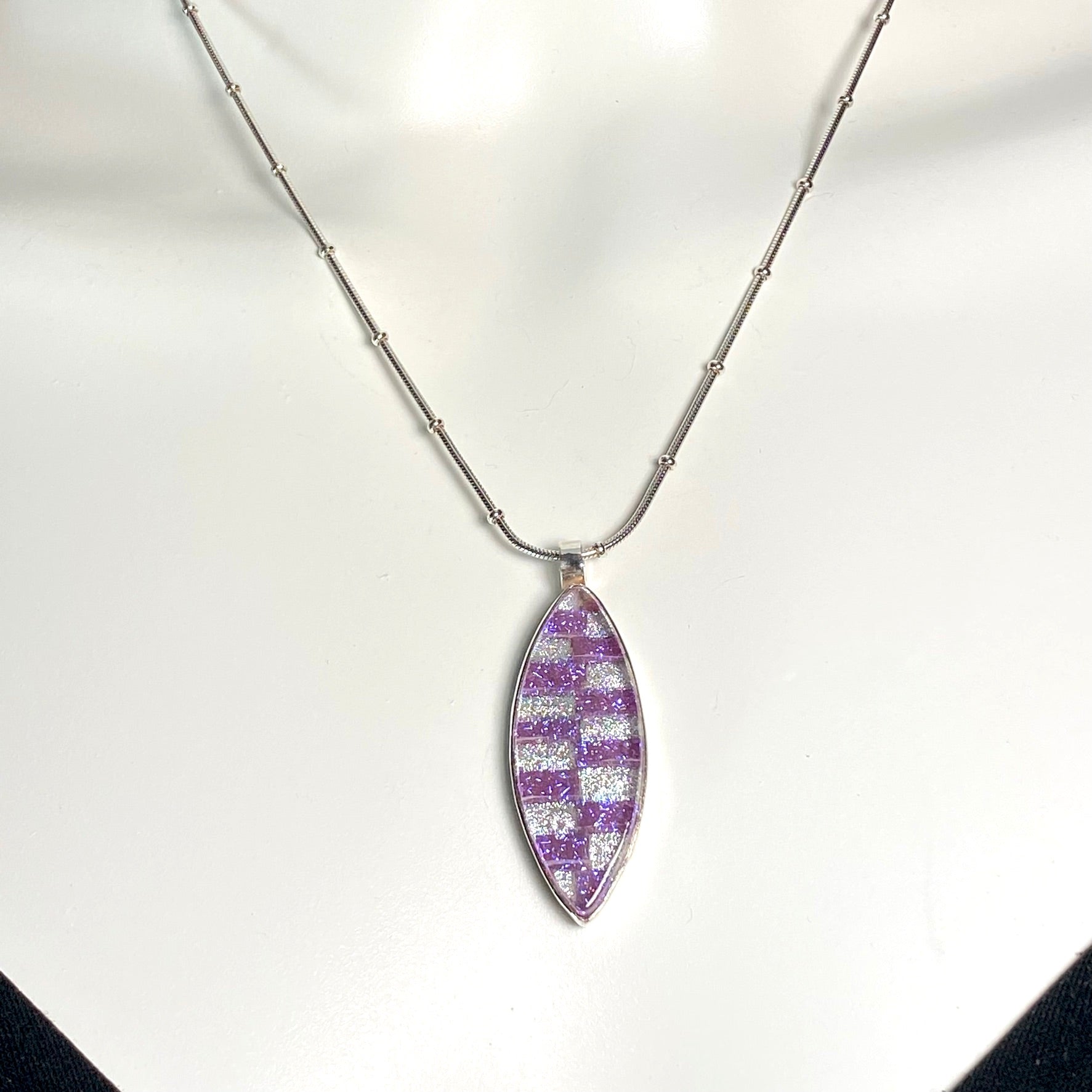 Two tone checkerboard marquise necklace in cotton candy pink and white pearl glass, fused glass, glass jewelry, glass and silver jewelry, handmade, handcrafted, American Craft, hand fabricated jewelry, hand fabricated jewellery, Athen, Georgia, colorful jewelry, sparkle, bullseye glass, dichroic glass, art jewelry