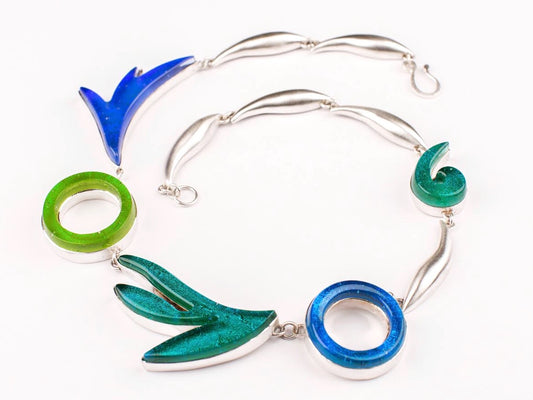 Statement necklace in turquoise, green, teal, azure colored glass in sterling silver, fused glass, glass jewelry, glass and silver jewelry, handmade, handcrafted, American Craft, hand fabricated jewelry, hand fabricated jewellery, Athen, Georgia, colorful jewelry, sparkle, bullseye glass, dichroic glass, art jewelry