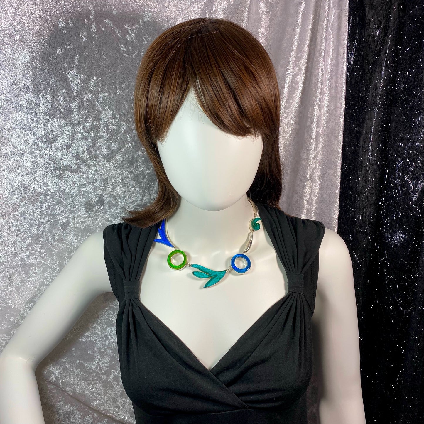 Statement necklace in turquoise, green, teal, azure colored glass in sterling silver, fused glass, glass jewelry, glass and silver jewelry, handmade, handcrafted, American Craft, hand fabricated jewelry, hand fabricated jewellery, Athen, Georgia, colorful jewelry, sparkle, bullseye glass, dichroic glass, art jewelry