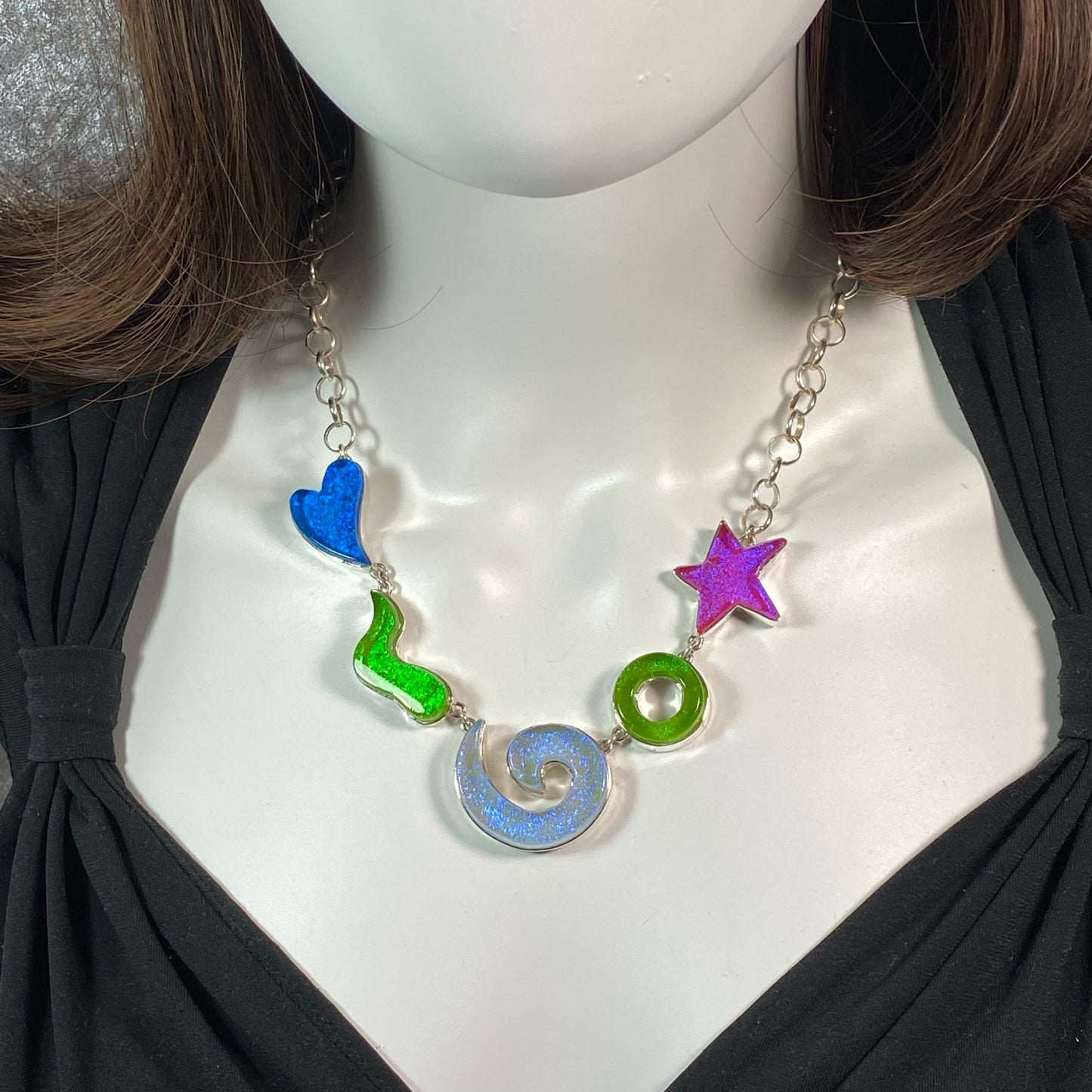 Statement necklace in turquoise, green, lavendar, and pink glass in sterling silver, fused glass, glass jewelry, glass and silver jewelry, handmade, handcrafted, American Craft, hand fabricated jewelry, hand fabricated jewellery, Athen, Georgia, colorful jewelry, sparkle, bullseye glass, dichroic glass, art jewelry