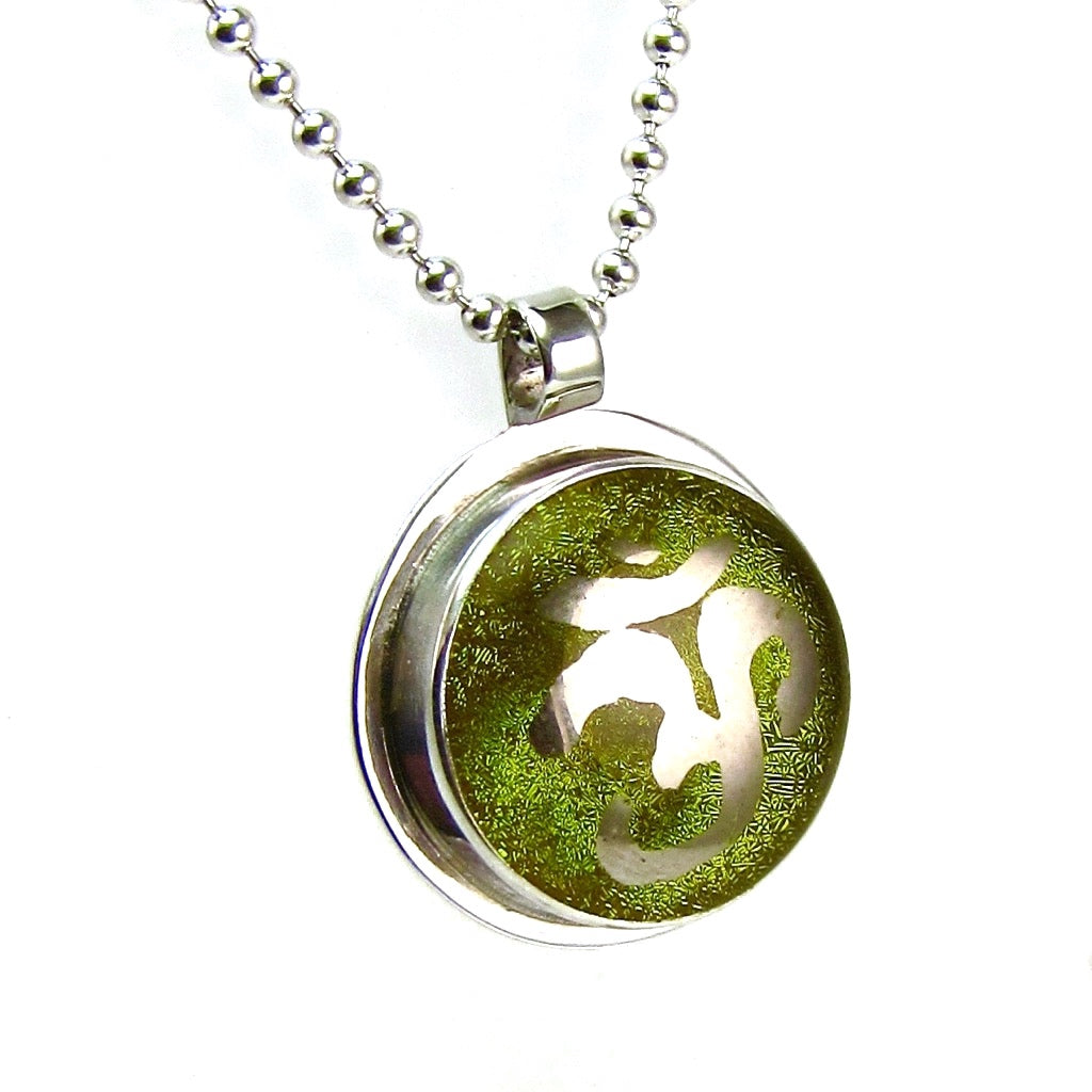 Namaste painted silver luster over green necklace, fused glass, glass jewelry, glass and silver jewelry, handmade, handcrafted, American Craft, hand fabricated jewelry, hand fabricated jewellery, Athen, Georgia, colorful jewelry, sparkle, bullseye glass, dichroic glass, art jewelry