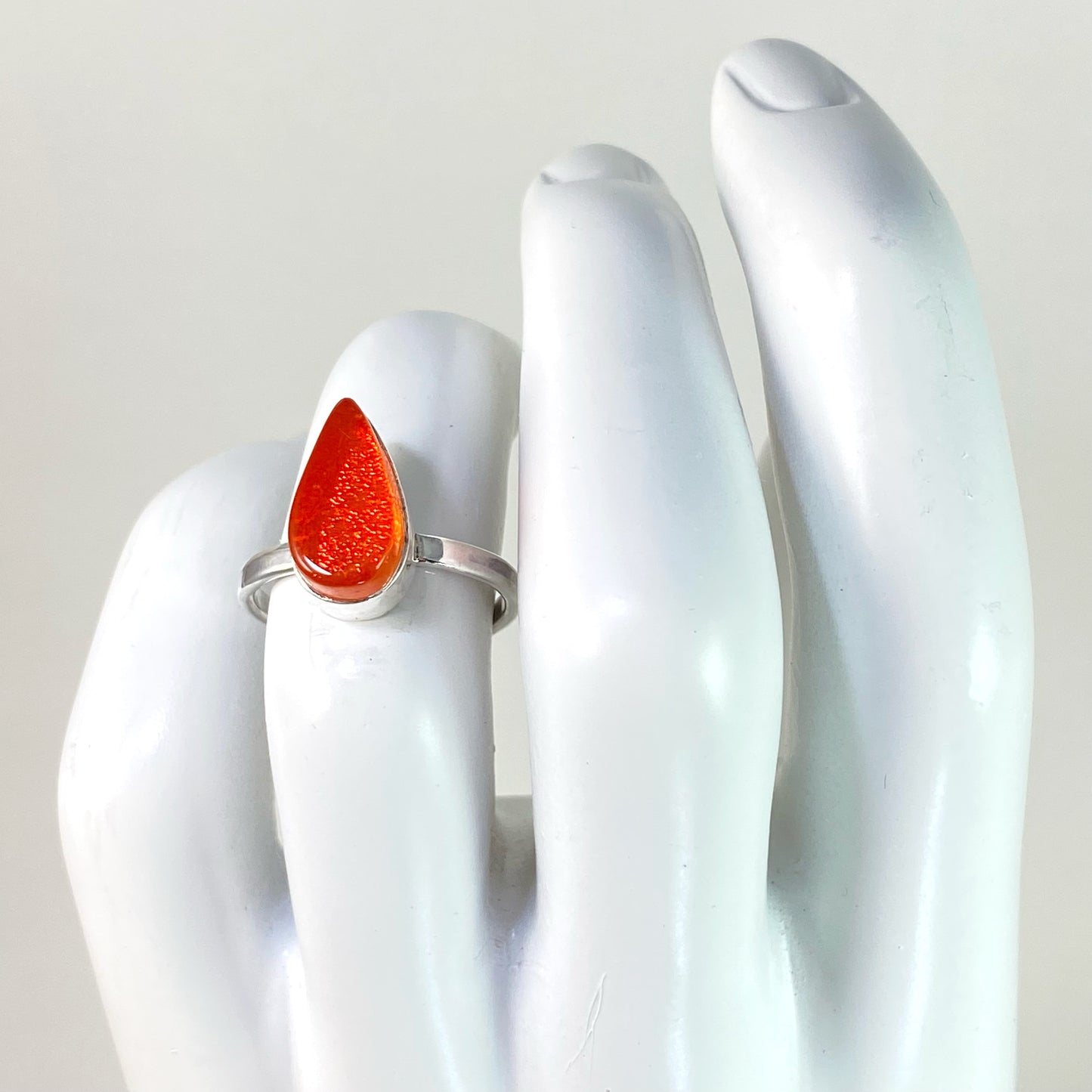 orange teardrop glass ring, fused glass, glass jewelry, glass and silver jewelry, handmade, handcrafted, American Craft, hand fabricated jewelry, hand fabricated jewellery, Athen, Georgia, colorful jewelry, sparkle, bullseye glass, dichroic glass, art jewelry