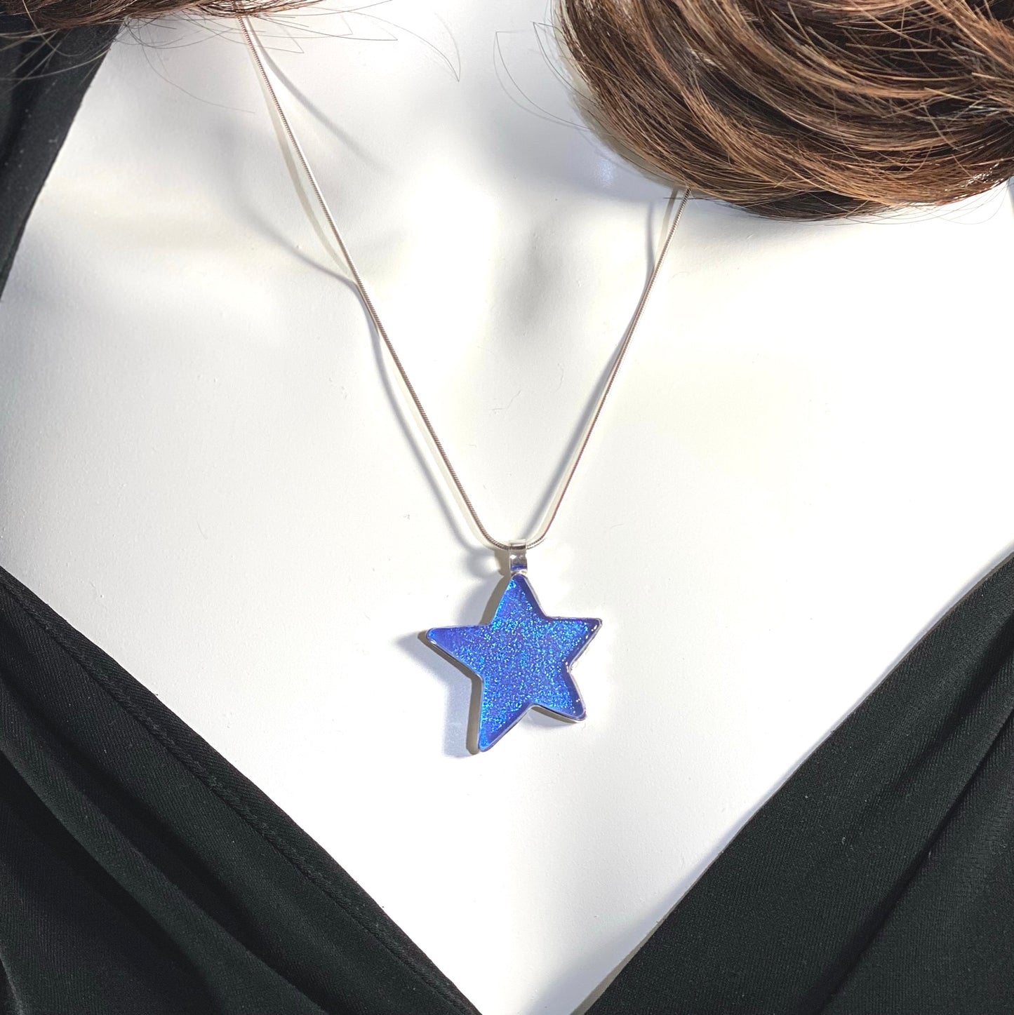 sky blue star pendant, hand cut, necklace, fused glass, glass jewelry, glass and silver jewelry, handmade, handcrafted, American Craft, hand fabricated jewelry, hand fabricated jewellery, Athen, Georgia, colorful jewelry, sparkle, bullseye glass, dichroic glass, art jewelry