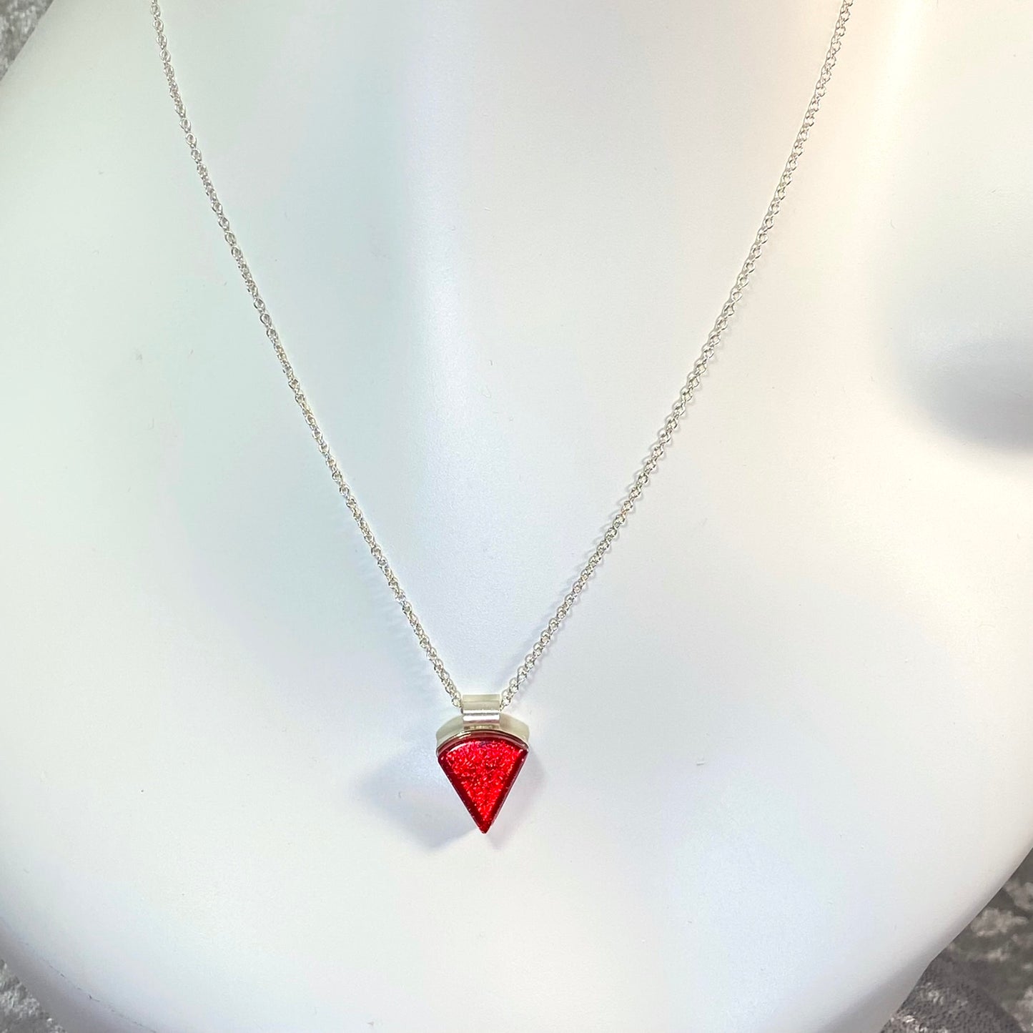 Triangle cherry red glass small necklace, sterling silver cable chain, glass jewelry, glass and silver jewelry, handmade, handcrafted, American Craft, hand fabricated jewelry, hand fabricated jewellery, Athen, Georgia, colorful jewelry, sparkle, bullseye glass, dichroic glass, art jewelry