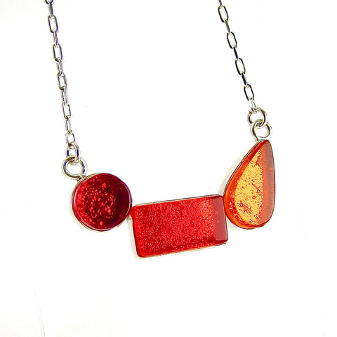 modern art inspired 3 element necklace, red, orange, fused glass, glass jewelry, glass and silver jewelry, handmade, handcrafted, American Craft, hand fabricated jewelry, hand fabricated jewellery, Athen, Georgia, colorful jewelry, sparkle, bullseye glass, dichroic glass, art jewelry