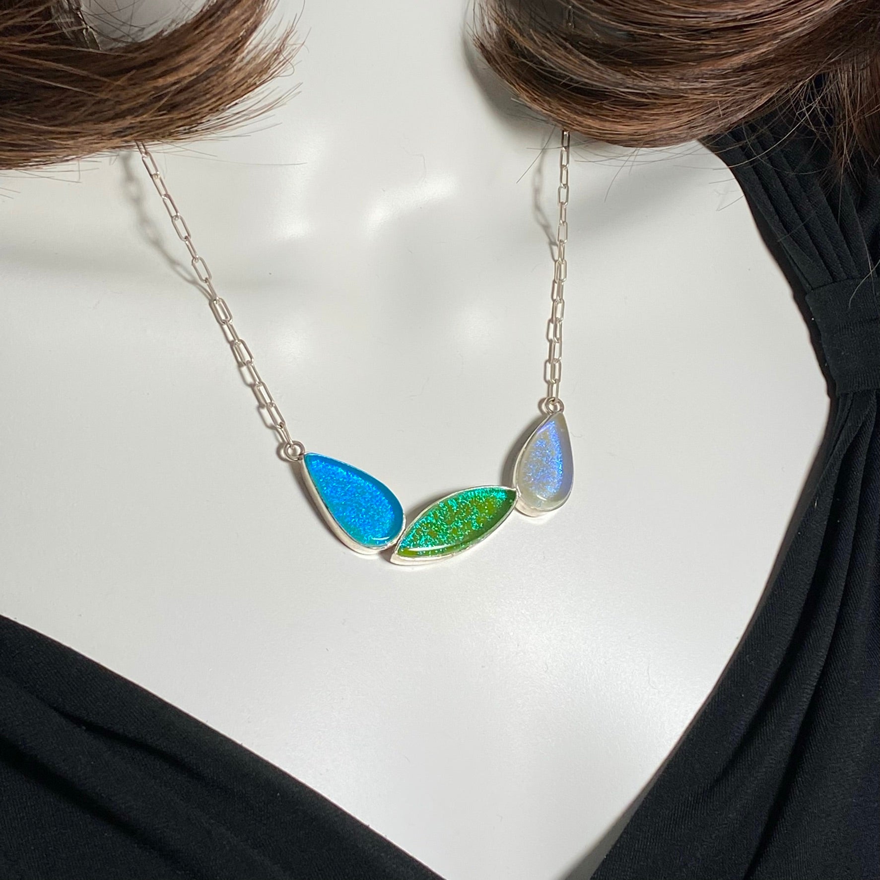 mid century modern, leaf necklace, three elements, blue, purple, green, fused glass, glass jewelry, glass and silver jewelry, handmade, handcrafted, American Craft, hand fabricated jewelry, hand fabricated jewellery, Athen, Georgia, colorful jewelry, sparkle, bullseye glass, dichroic glass, art jewelry