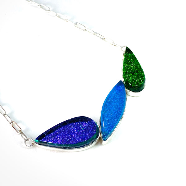 mid century modern, leaf necklace, three elements, purple, blue and green, fused glass, glass jewelry, glass and silver jewelry, handmade, handcrafted, American Craft, hand fabricated jewelry, hand fabricated jewellery, Athen, Georgia, colorful jewelry, sparkle, bullseye glass, dichroic glass, art jewelry