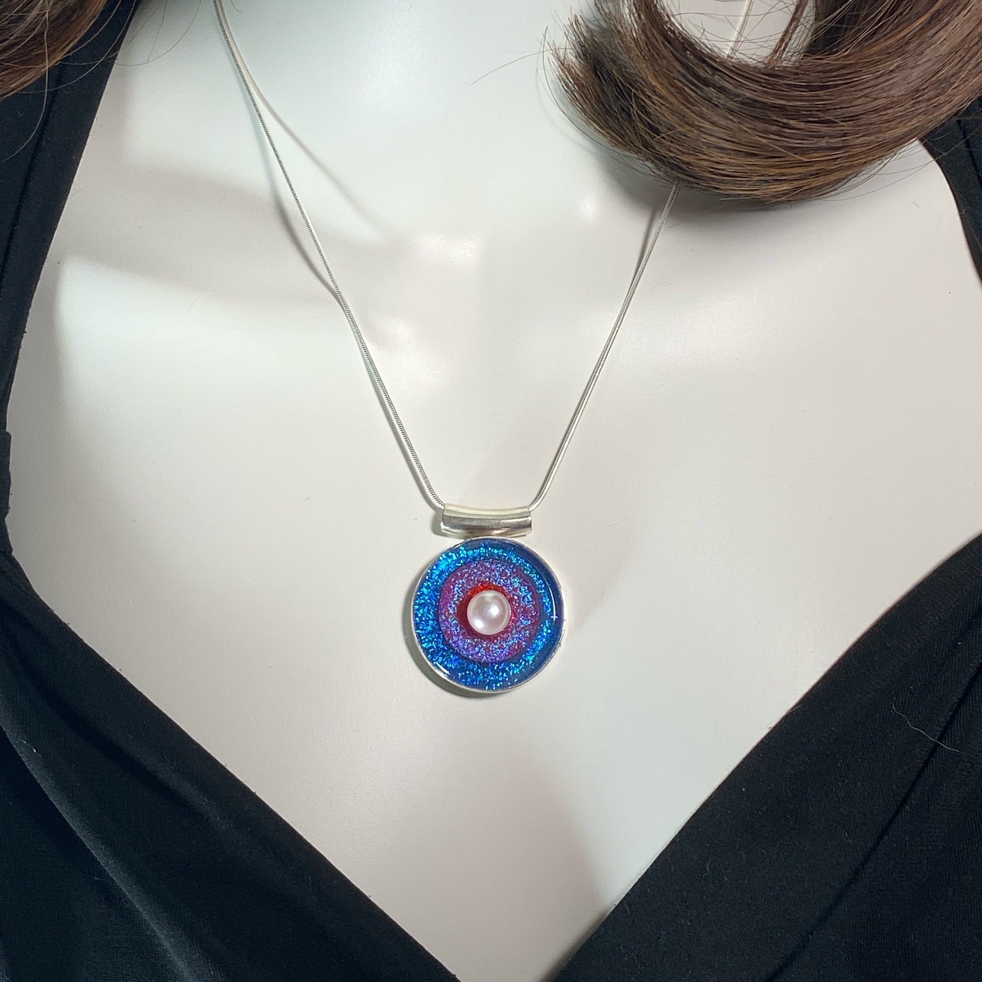 Triple ring bullseye circle pendant with pearl in blue, purple and orange glass, fused glass, glass jewelry, glass and silver jewelry, handmade, handcrafted, American Craft, hand fabricated jewelry, hand fabricated jewellery, Athen, Georgia, colorful jewelry, sparkle, bullseye glass, dichroic glass, art jewelry
