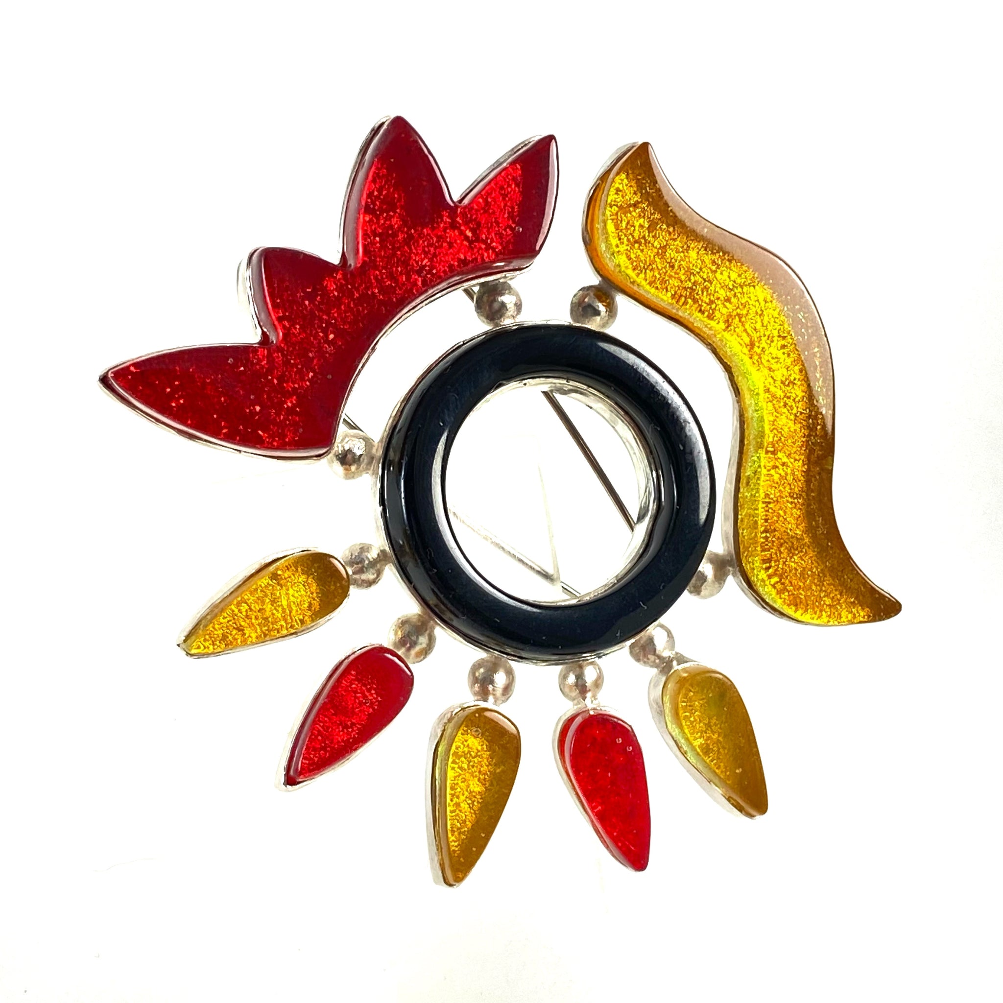 hand cut yellow and red abstract elements and water jet black glass circle brooch, fused glass, glass jewelry, glass and silver jewelry, handmade, handcrafted, American Craft, hand fabricated jewelry, hand fabricated jewellery, Athen, Georgia, colorful jewelry, sparkle, bullseye glass, dichroic glass, art jewelry