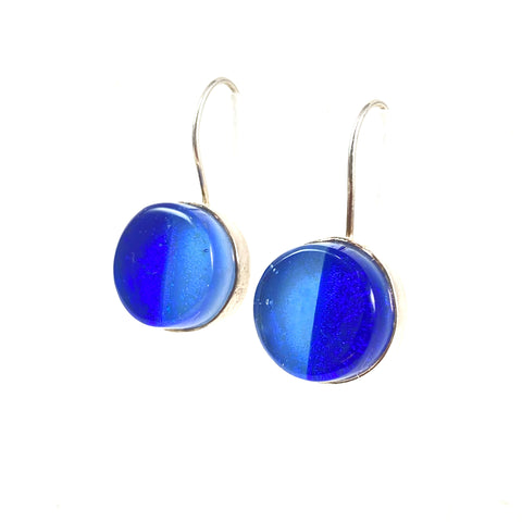 two tone circle earrings in light and dark blue,fused glass, glass jewelry, glass and silver jewelry, handmade, handcrafted, American Craft, hand fabricated jewelry, hand fabricated jewellery, Athen, Georgia, colorful jewelry, sparkle, bullseye glass, dichroic glass, art jewelry