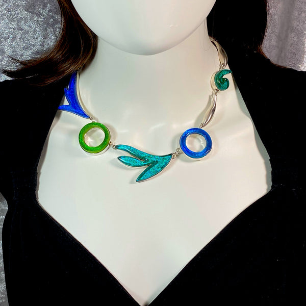 Statement necklace in turquoise, green, teal, azure colored glass in sterling silver, fused glass, glass jewelry, glass and silver jewelry, handmade, handcrafted, American Craft, hand fabricated jewelry, hand fabricated jewellery, Athen, Georgia, colorful jewelry, sparkle, bullseye glass, dichroic glass, art jewelry