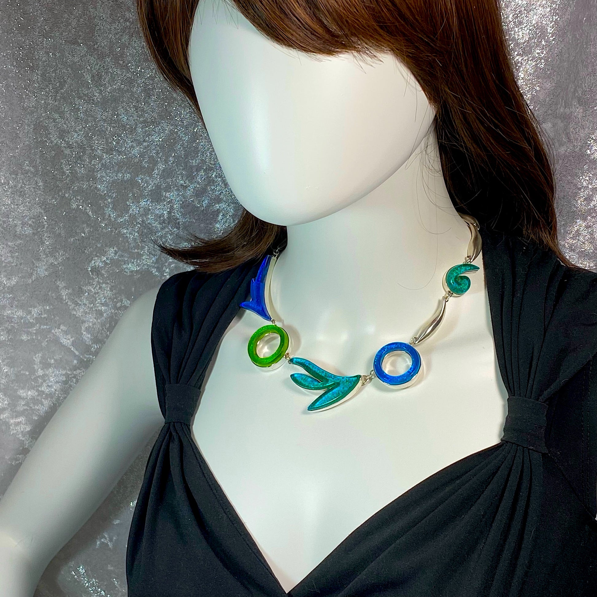 Statement necklace in turquoise, green, teal, azure colored glass in sterling silver, fused glass, glass jewelry, glass and silver jewelry, handmade, handcrafted, American Craft, hand fabricated jewelry, hand fabricated jewellery, Athen, Georgia, colorful jewelry, sparkle, bullseye glass, dichroic glass, art jewelry