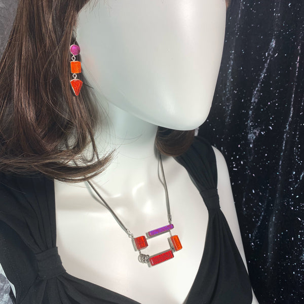 open rectangle necklace, mid century modern inspired, red, orange and pink, fused glass, glass jewelry, glass and silver jewelry, handmade, handcrafted, American Craft, hand fabricated jewelry, hand fabricated jewellery, Athen, Georgia, colorful jewelry, sparkle, bullseye glass, dichroic glass, art jewelry
