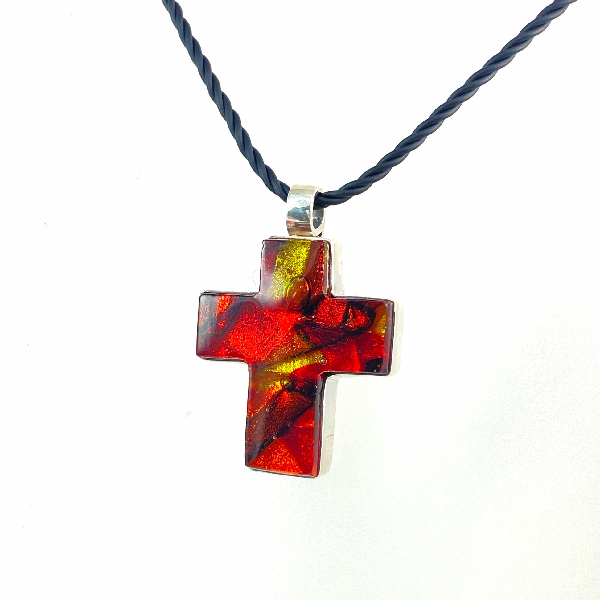 Sun melange mixture of red, gold and orange glass, ,fused glass  in a cross shape necklace, glass jewelry, glass and silver jewelry, handmade, handcrafted, American Craft, hand fabricated jewelry, hand fabricated jewellery, Athen, Georgia, colorful jewelry, sparkle, bullseye glass, dichroic glass, art jewelry