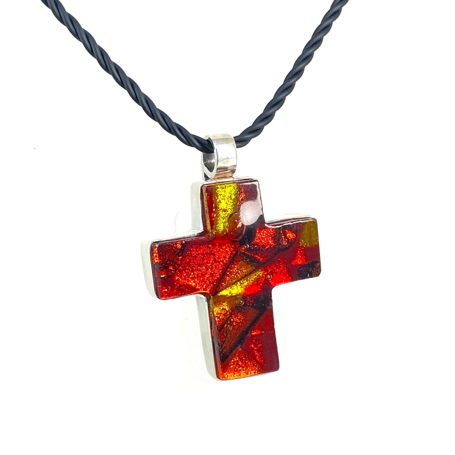 Sun melange mixture of red, gold and orange glass, ,fused glass in a cross shape necklace, glass jewelry, glass and silver jewelry, handmade, handcrafted, American Craft, hand fabricated jewelry, hand fabricated jewellery, Athen, Georgia, colorful jewelry, sparkle, bullseye glass, dichroic glass, art jewelry