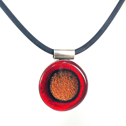 Circle pendant with copper and red colored glass in sterling silver, fused glass, glass jewelry, glass and silver jewelry, handmade, handcrafted, American Craft, hand fabricated jewelry, hand fabricated jewellery, Athen, Georgia, colorful jewelry, sparkle, bullseye glass, dichroic glass, art jewelry