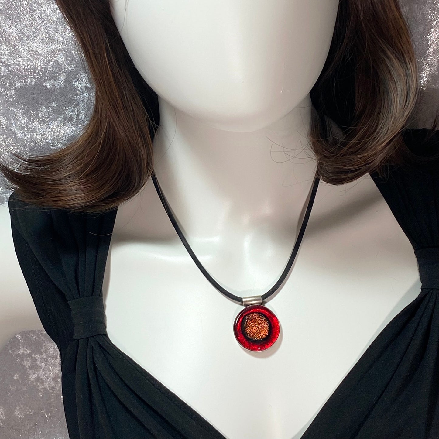 Circle pendant with copper and red colored glass in sterling silver, fused glass, glass jewelry, glass and silver jewelry, handmade, handcrafted, American Craft, hand fabricated jewelry, hand fabricated jewellery, Athen, Georgia, colorful jewelry, sparkle, bullseye glass, dichroic glass, art jewelry