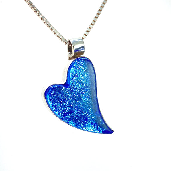 curved glass heart, necklace, sapphire blue, fused glass, glass jewelry, glass and silver jewelry, handmade, handcrafted, American Craft, hand fabricated jewelry, hand fabricated jewellery, Athen, Georgia, colorful jewelry, sparkle, bullseye glass, dichroic glass, art jewelry