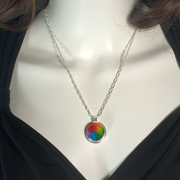 kaleidoscope circle necklace in rainbow colors, fused glass, glass jewelry, glass and silver jewelry, handmade, handcrafted, American Craft, hand fabricated jewelry, hand fabricated jewellery, Athen, Georgia, colorful jewelry, sparkle, bullseye glass, dichroic glass, art jewelry