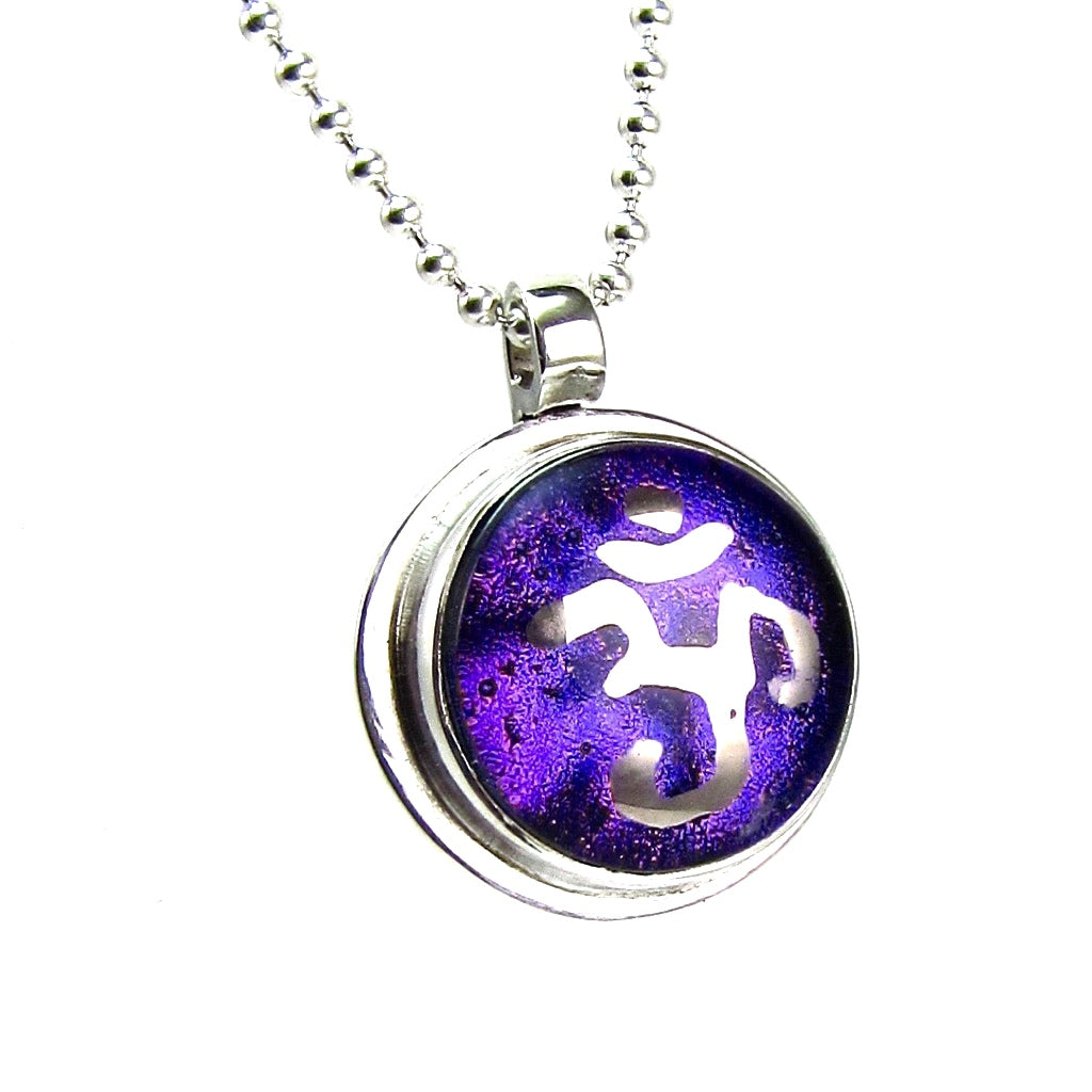 Namaste painted silver luster over purple necklace, fused glass, glass jewelry, glass and silver jewelry, handmade, handcrafted, American Craft, hand fabricated jewelry, hand fabricated jewellery, Athen, Georgia, colorful jewelry, sparkle, bullseye glass, dichroic glass, art jewelry 