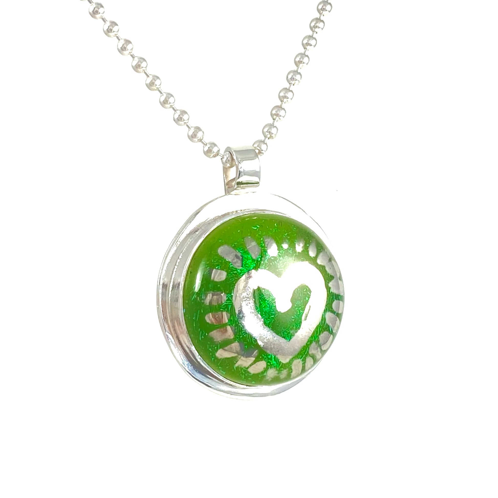 Silver luster painted heart over green necklace, fused glass, glass jewelry, glass and silver jewelry, handmade, handcrafted, American Craft, hand fabricated jewelry, hand fabricated jewellery,  Athen, Georgia, colorful jewelry, sparkle, bullseye glass, dichroic glass, art jewelry  