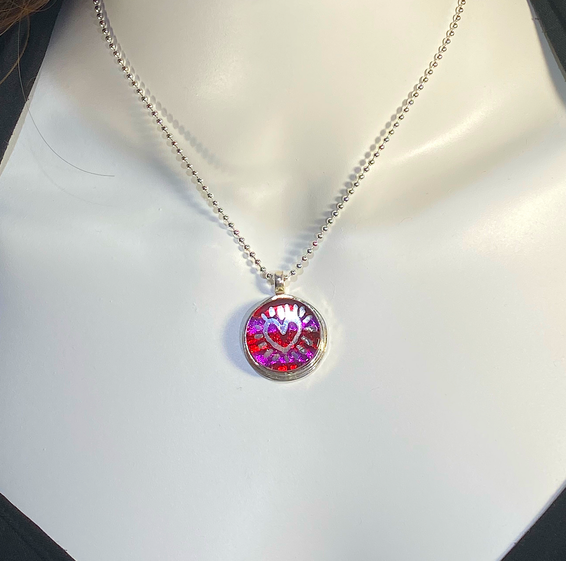 Silver luster painted striped circle necklace in pink and purple, fused glass, glass jewelry, glass and silver jewelry, handmade, handcrafted, American Craft, hand fabricated jewelry, hand fabricated jewellery, Athen, Georgia, colorful jewelry, sparkle, bullseye glass, dichroic glass, art jewelry 