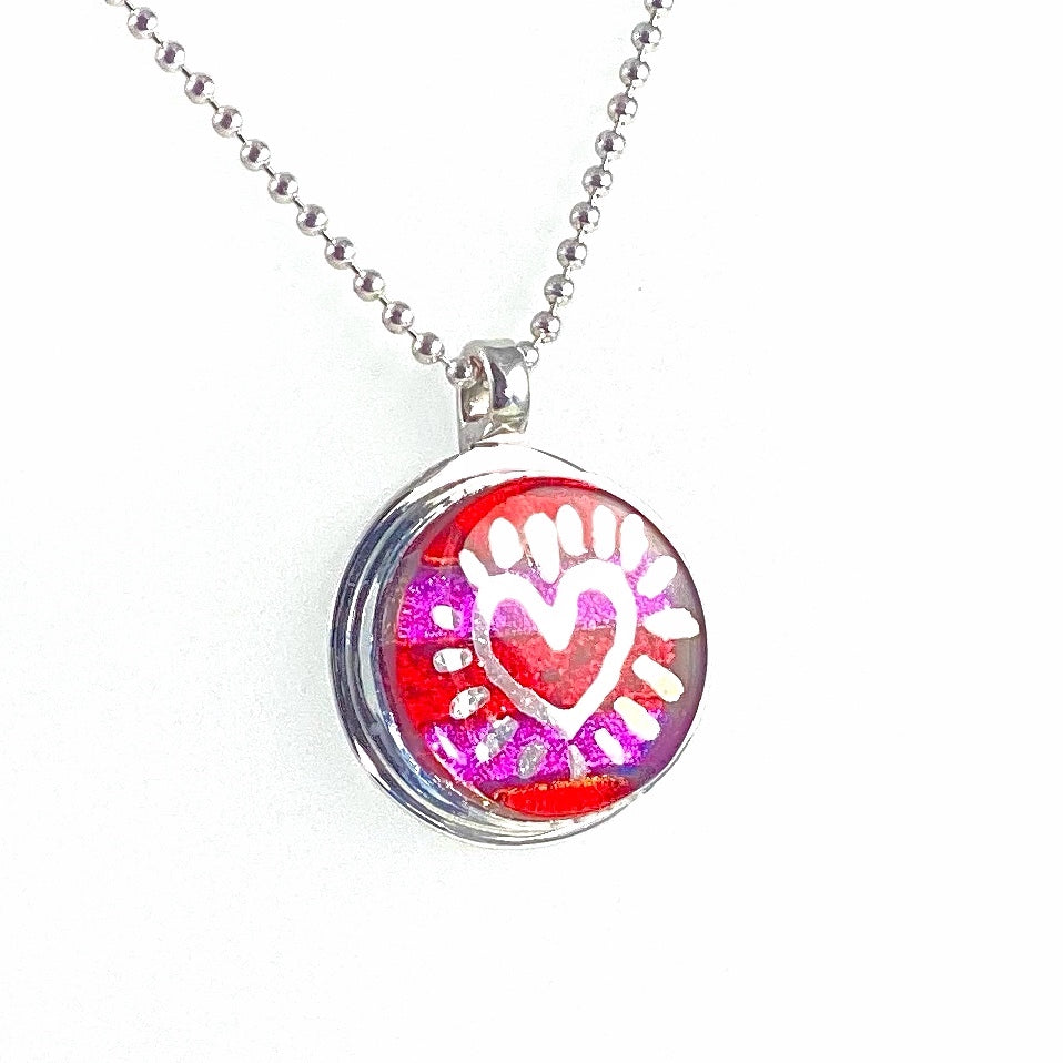 Silver luster painted striped circle necklace in pink and purple, fused glass, glass jewelry, glass and silver jewelry, handmade, handcrafted, American Craft, hand fabricated jewelry, hand fabricated jewellery,  Athen, Georgia, colorful jewelry, sparkle, bullseye glass, dichroic glass, art jewelry  