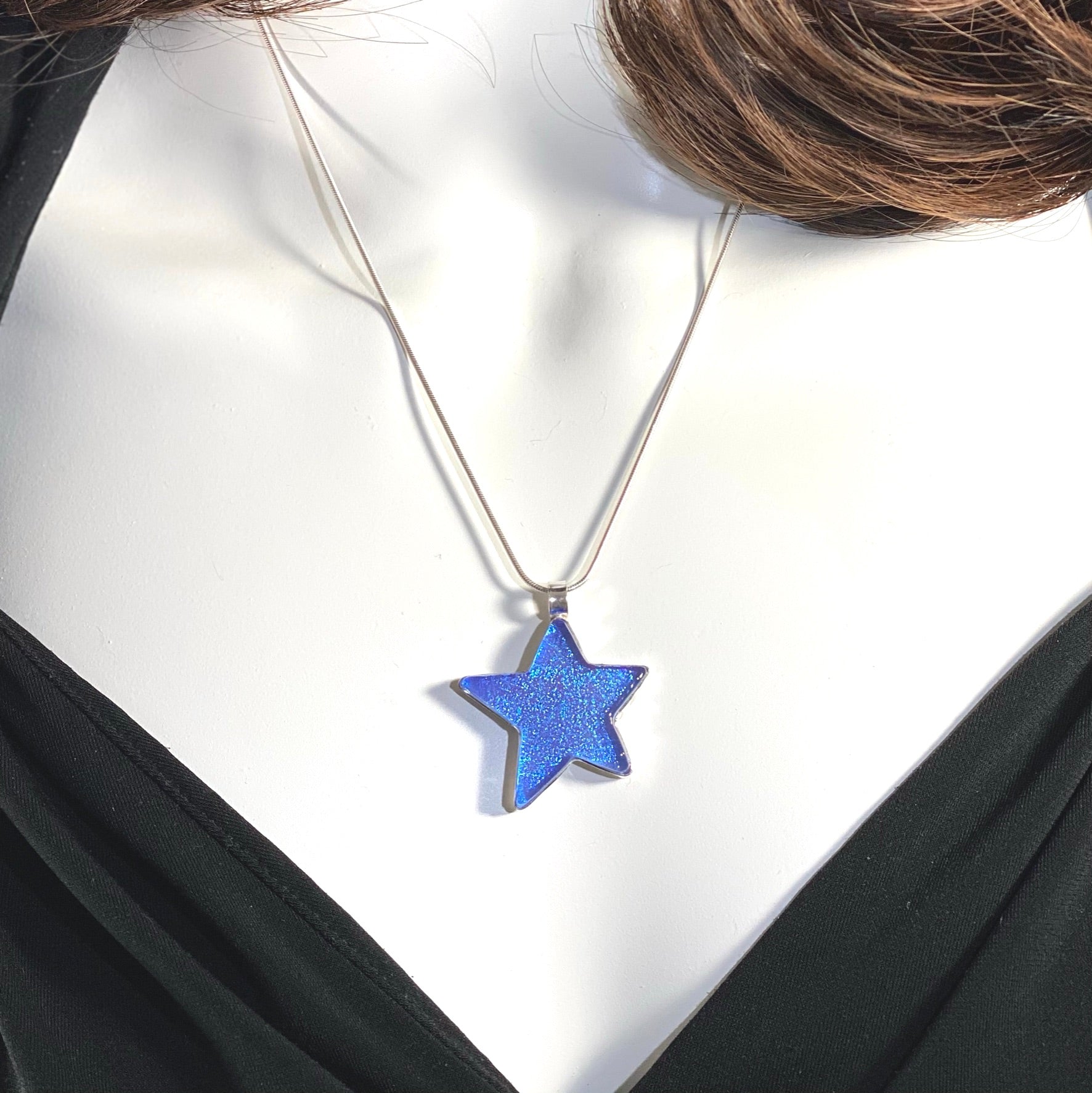 sky blue star pendant, hand cut, necklace, fused glass, glass jewelry, glass and silver jewelry, handmade, handcrafted, American Craft, hand fabricated jewelry, hand fabricated jewellery, Athen, Georgia, colorful jewelry, sparkle, bullseye glass, dichroic glass, art jewelry